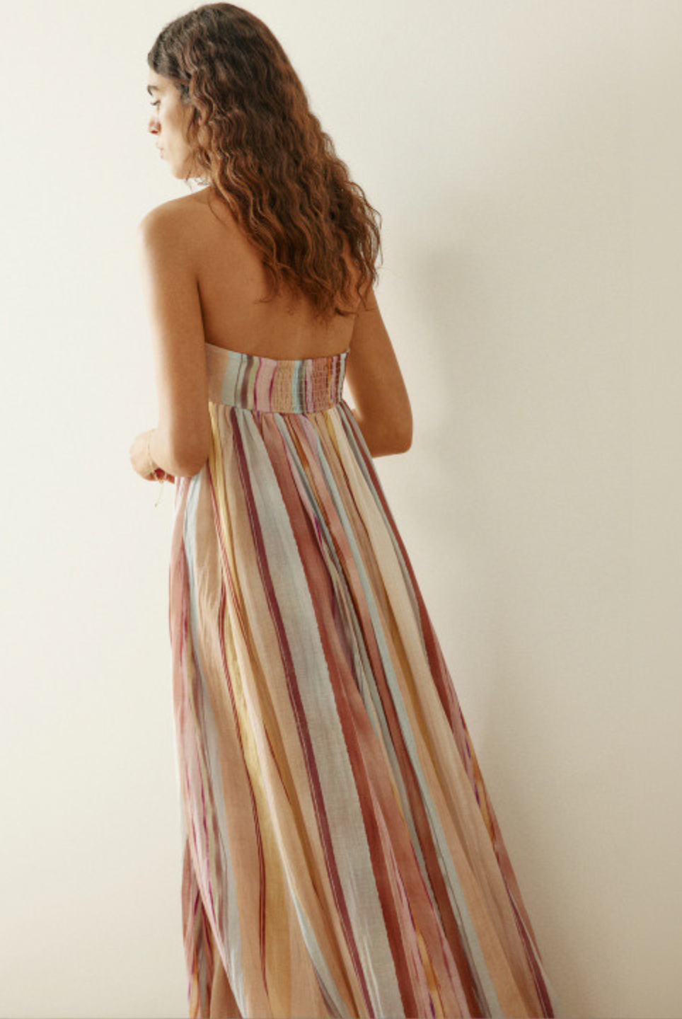 Back view of pastel striped long dress