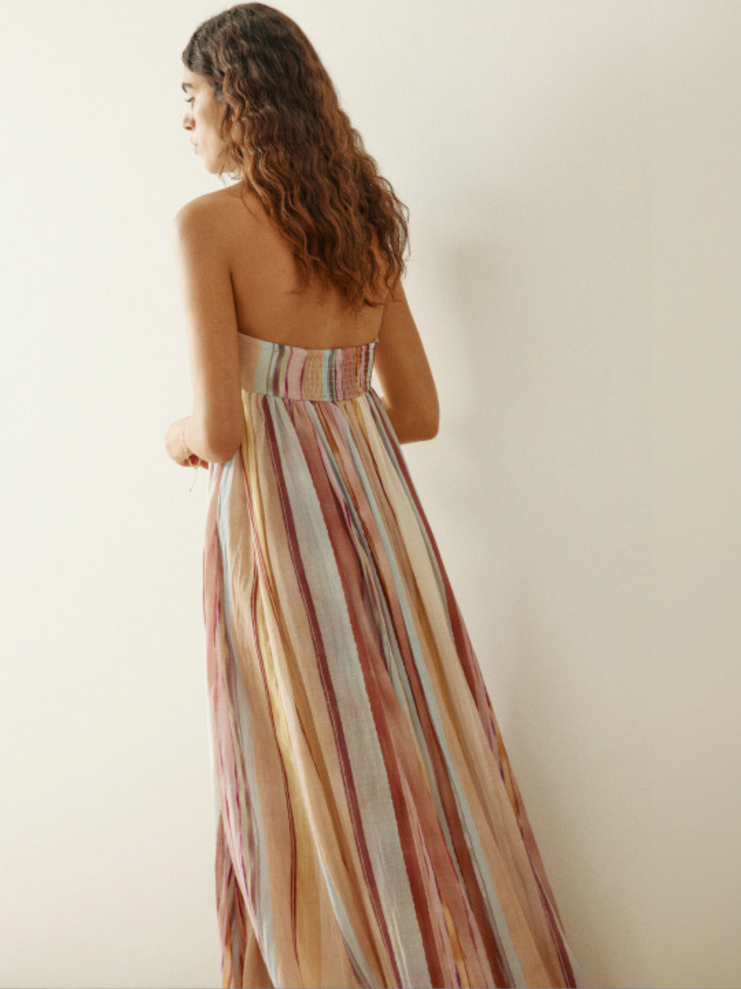 Back view of pastel striped long dress